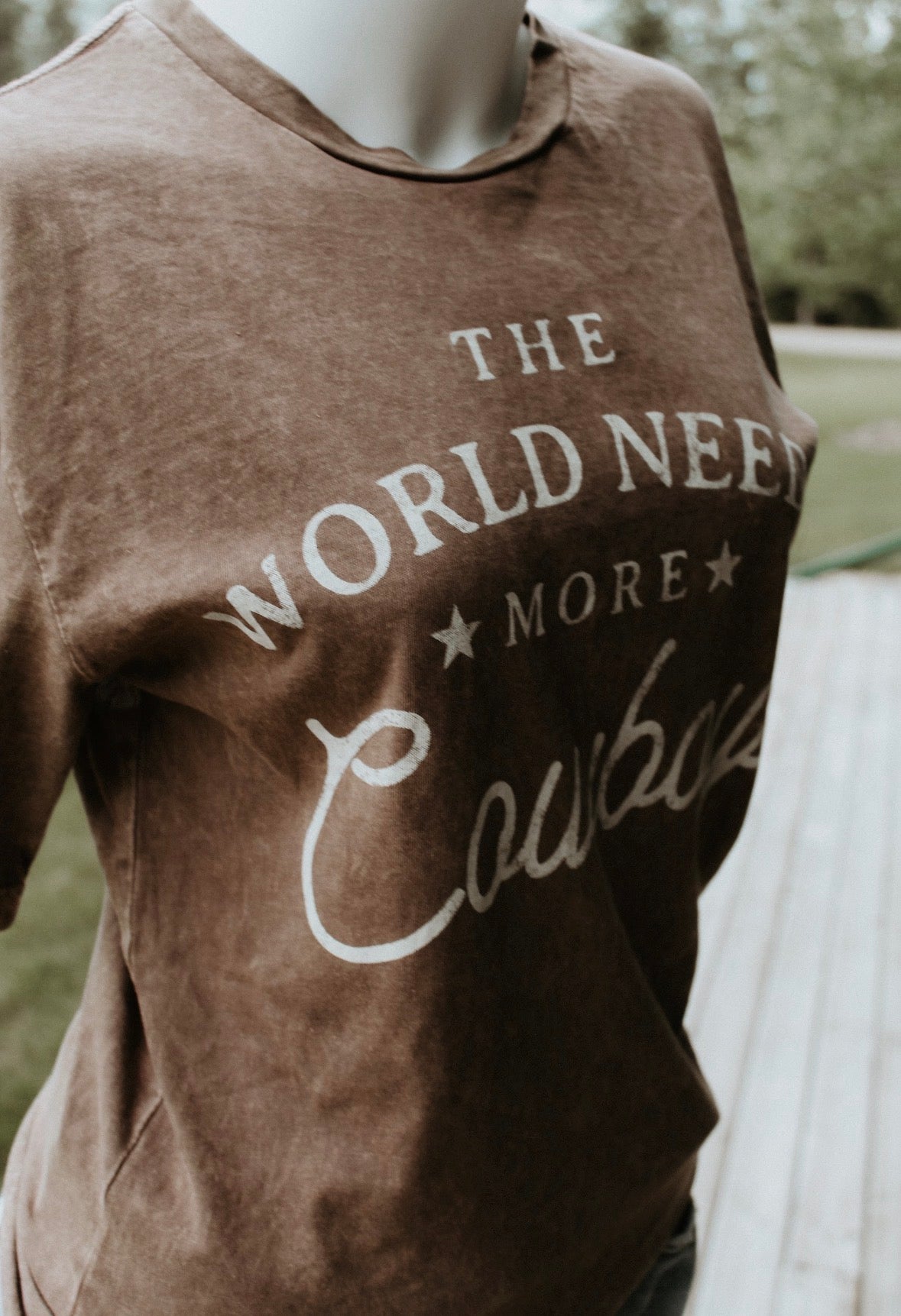 The World Needs More Cowboys Brown Tee